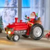 Dekofigur "Santa auf Traktor" mit Musik und LED