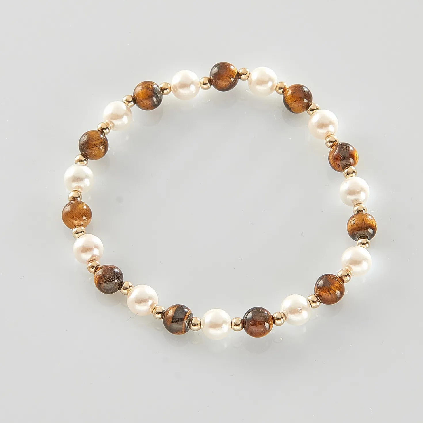 Muschelarmband mit Tigerauge